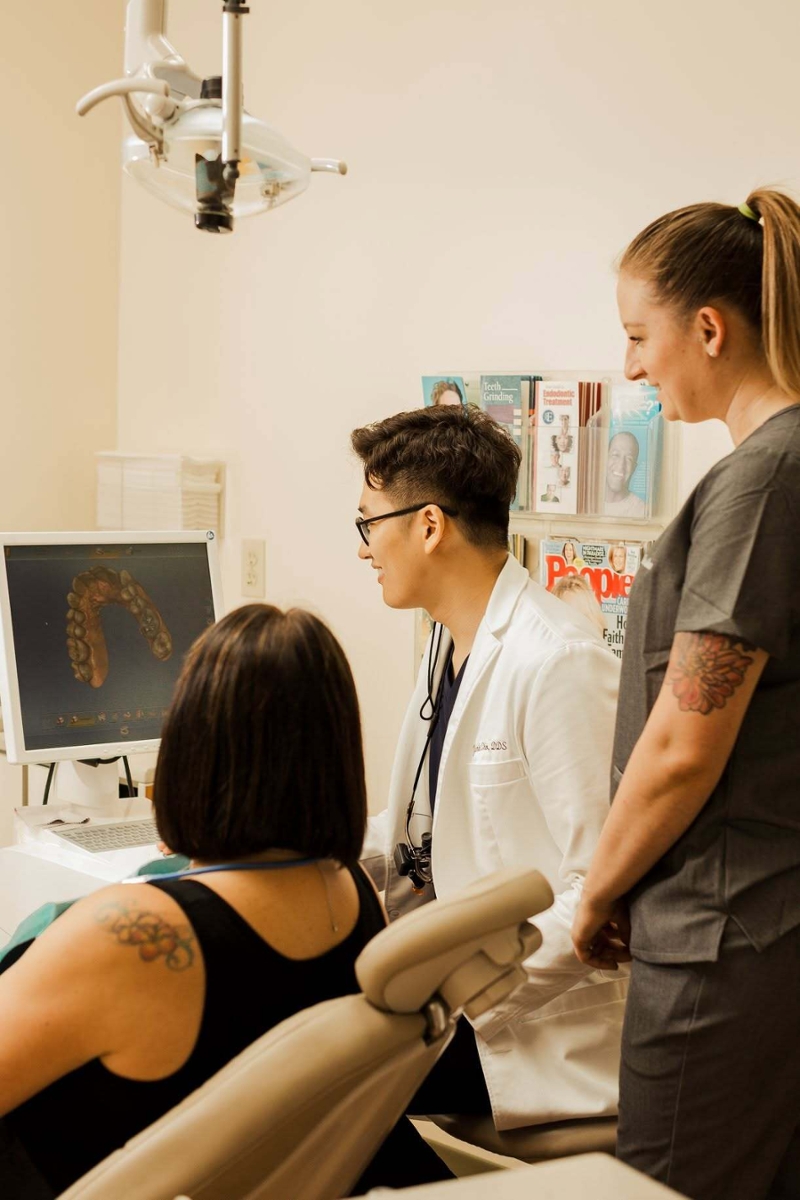 Dr. Yunki Cho looking at teeth impression