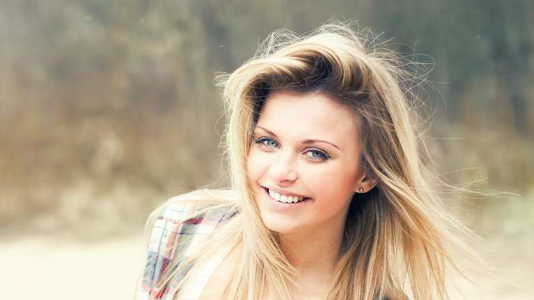 A smiling patient with Invisalign in Monroe, WA
