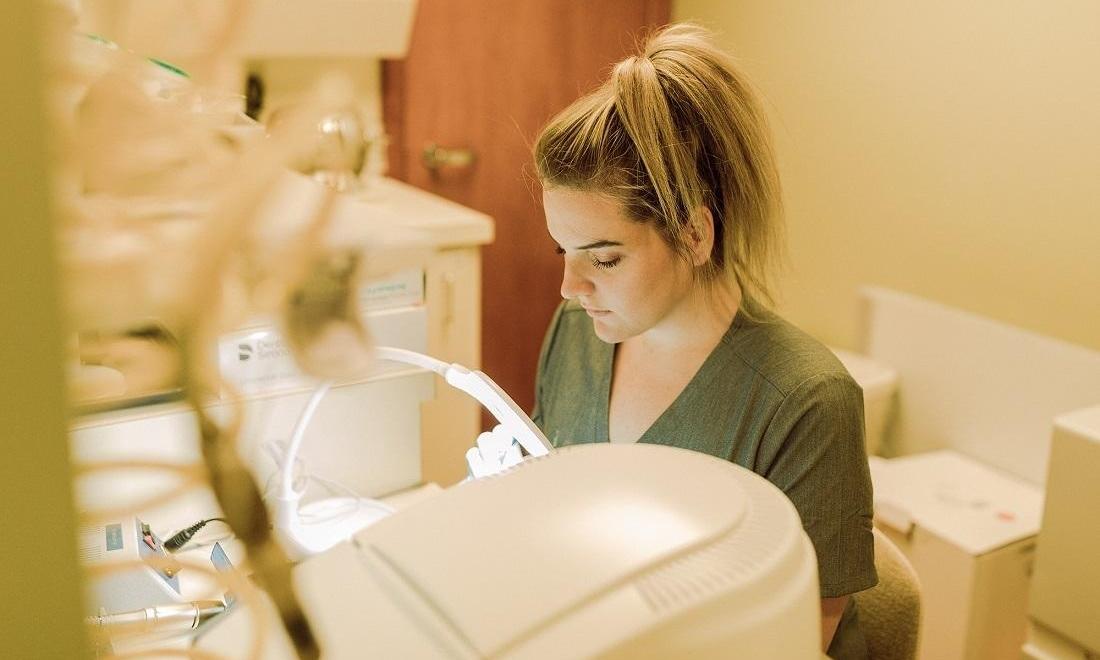 Registered dental assistant working in office